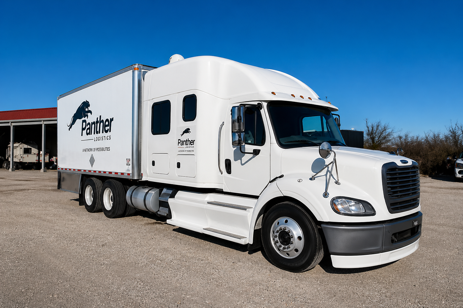 White tractor trailer staged in a truck yard